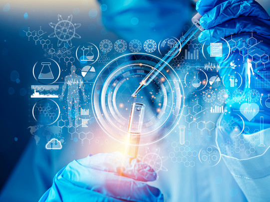 Photo/graphic combination in blue, on which the main motif is a person in laboratory clothing filling liquid into a test tube with a pipette. Numerous symbols and icons from chemistry and other sciences are depicted in front of the motif.