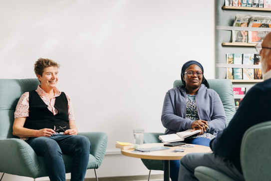 Three researchers have a lively conversation