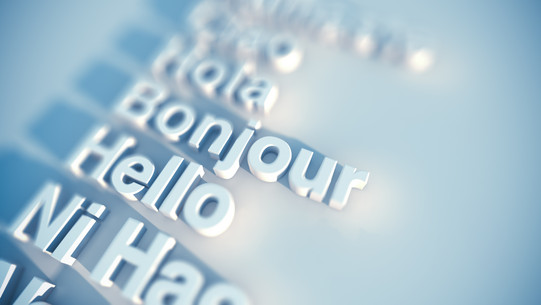 Stock photo with the greeting words ‘Hola’, ‘Bonjour’ and ‘Hello’.